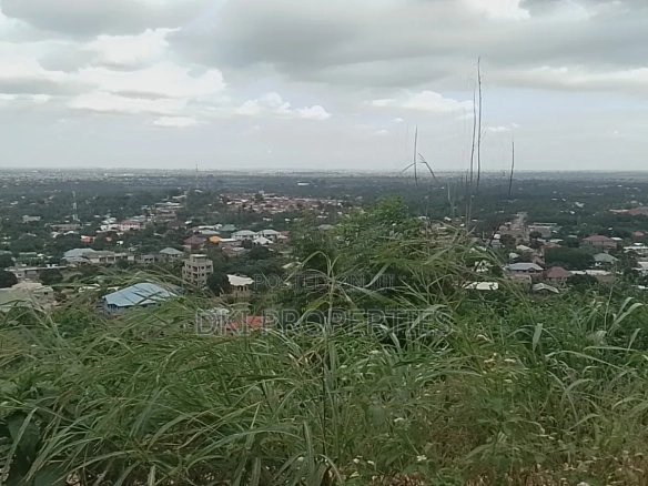 Photo of a cleared plot of residential land on a hilltop in Dodowa with a panoramic view of the area.
