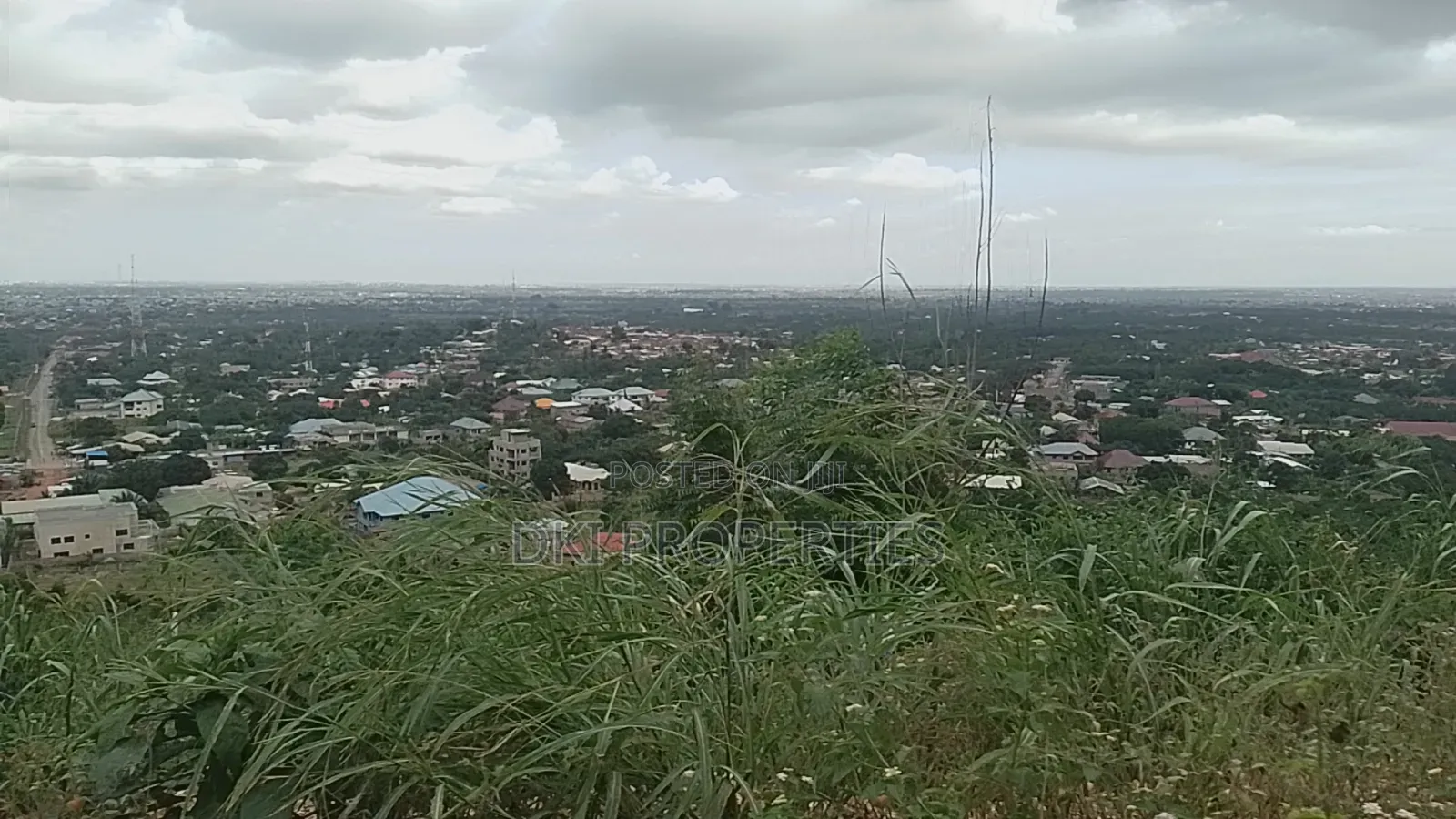 Photo of a cleared plot of residential land on a hilltop in Dodowa with a panoramic view of the area.