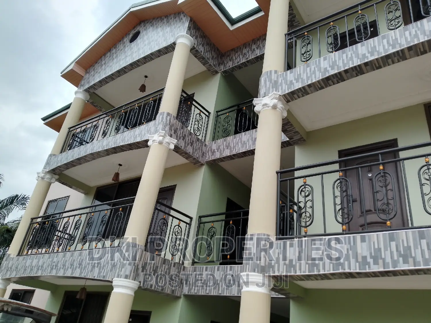 Oyibi 3 (1) Exterior view of a newly-built 2-bedroom apartment complex in Oyibi, Valley View Area, showcasing the modern façade and spacious compound/parking area.
