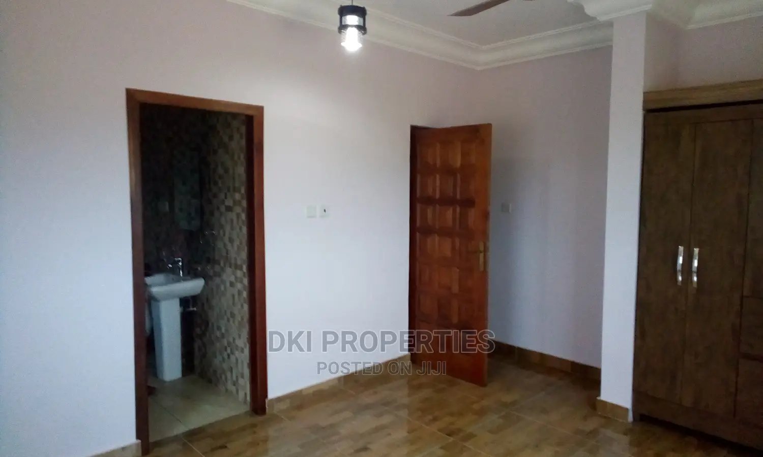 VV 2 (1) Exterior view of a newly-built executive 2-bedroom apartment complex in Oyibi, showing the clean, modern façade and proximity to the Valley View University campus.