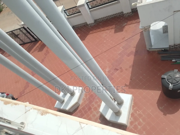 Exterior view of a cozy 2-bedroom semi-furnished apartment in Malejor, Valley View Area, showing the clean, well-maintained façade and spacious compound for parking.