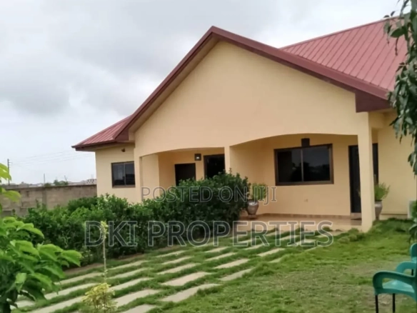 Exterior view of a newly-built 2-bedroom semi-detached house in a Gomoa Fetteh gated community, highlighting the proximity to the sea and the modern, secure development.