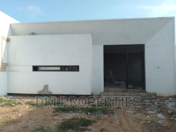 Exterior view of a nearly completed, newly-built 3-bedroom executive self-compound house in Oyibi, featuring a spacious compound and modern architecture.